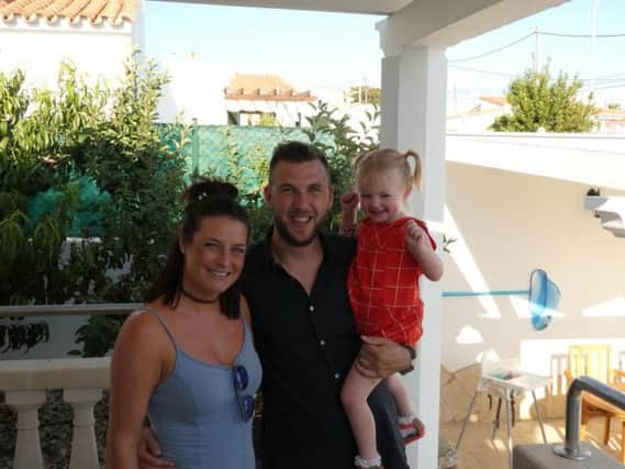 Holly and Mark Atkinson with their daughter Mia